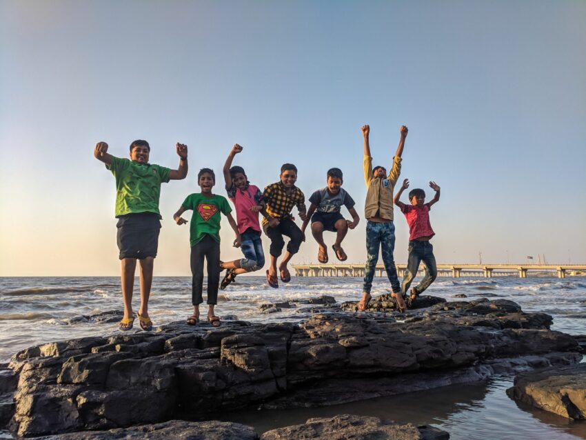 kids, jump,sea side,rocks