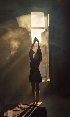 girl doing ballet with smoke in the background