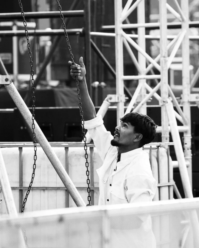 iron ladders, man giving instructions,site set up